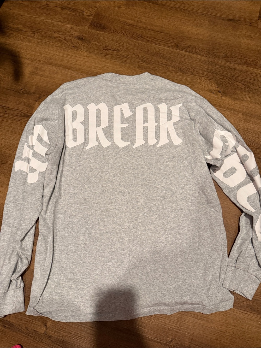 Gray Long-Sleeve Graphic Shirt with 'UNBREAKABLE' Print